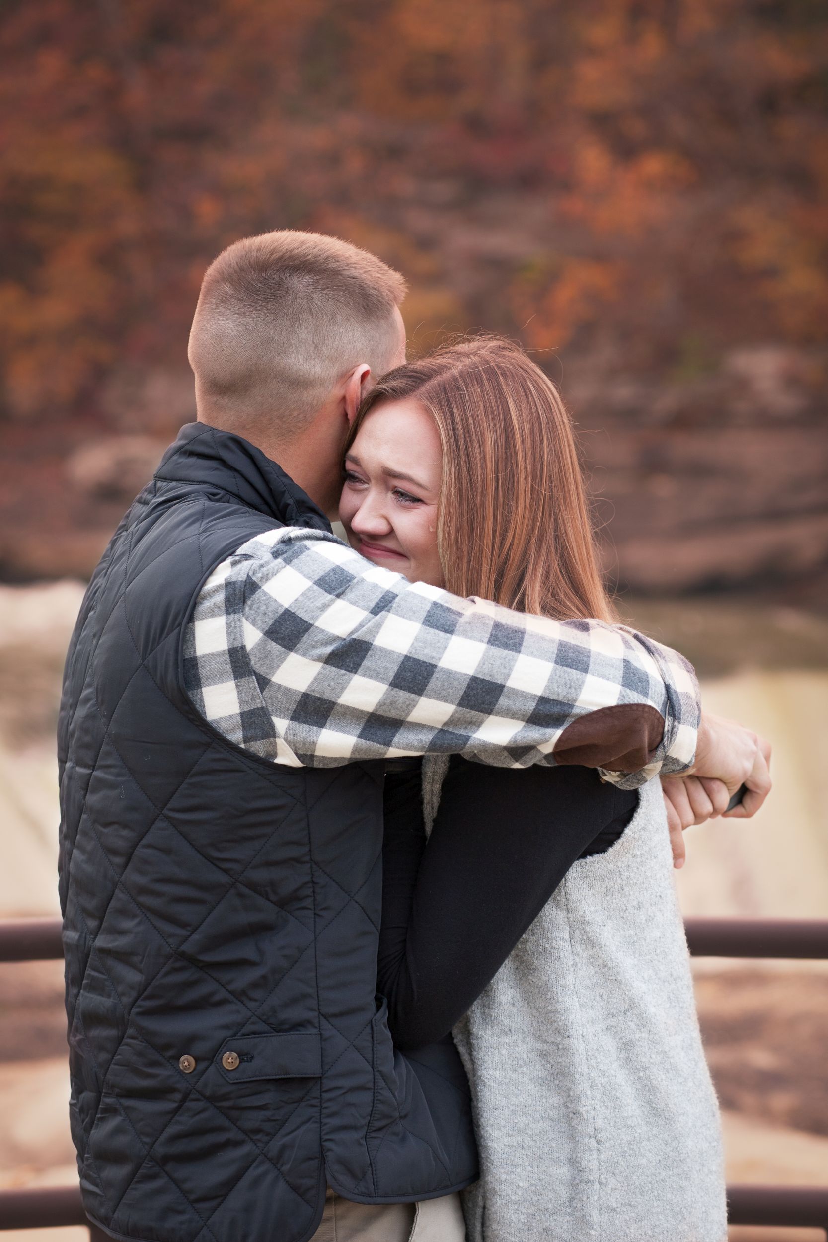 Fiancee and Fiance portrait at Cumberland Falls, Kentucky engagement by Fade To Blaq Photography