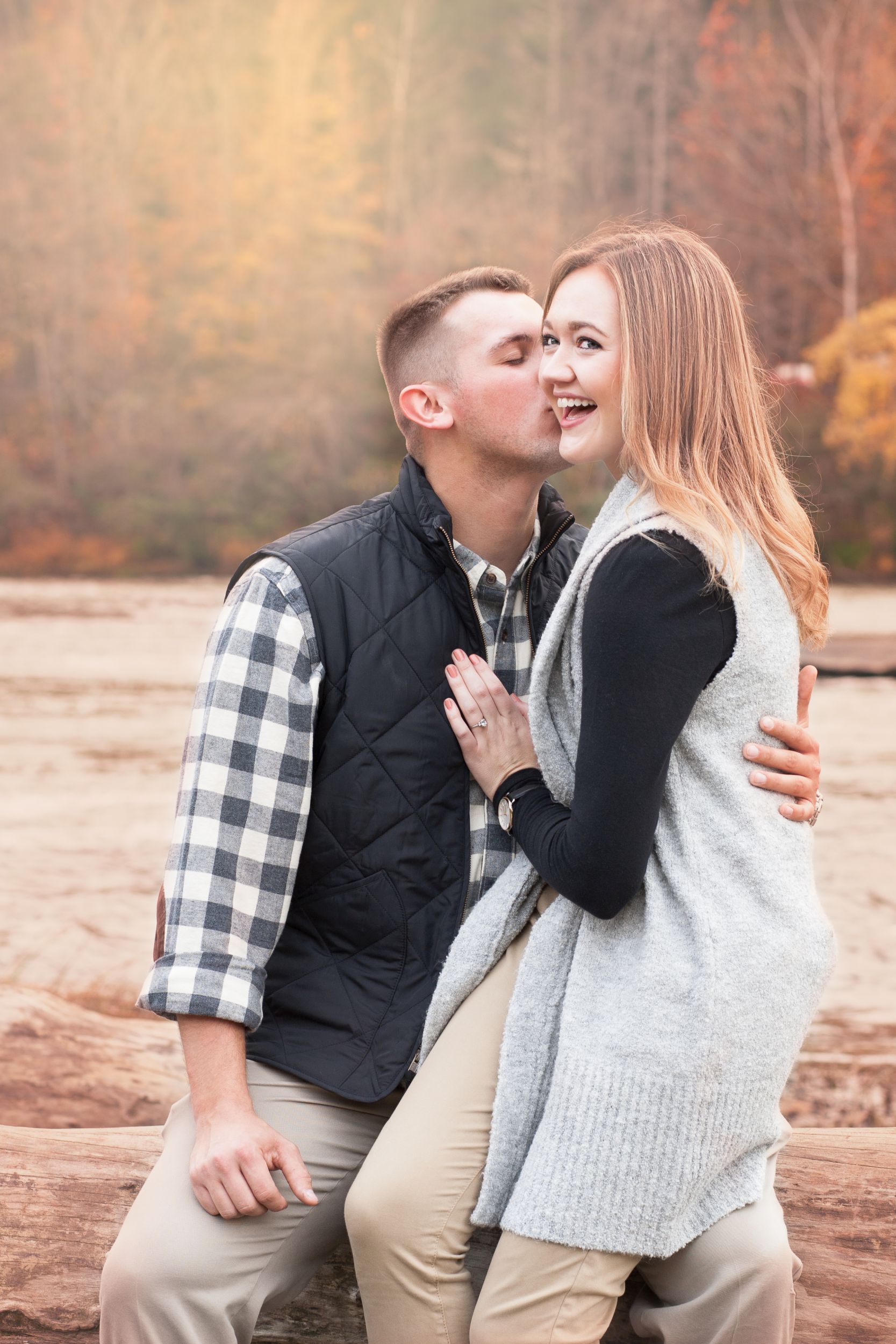 Fiancee and Fiance portrait at Cumberland Falls, Kentucky engagement by Fade To Blaq Photography