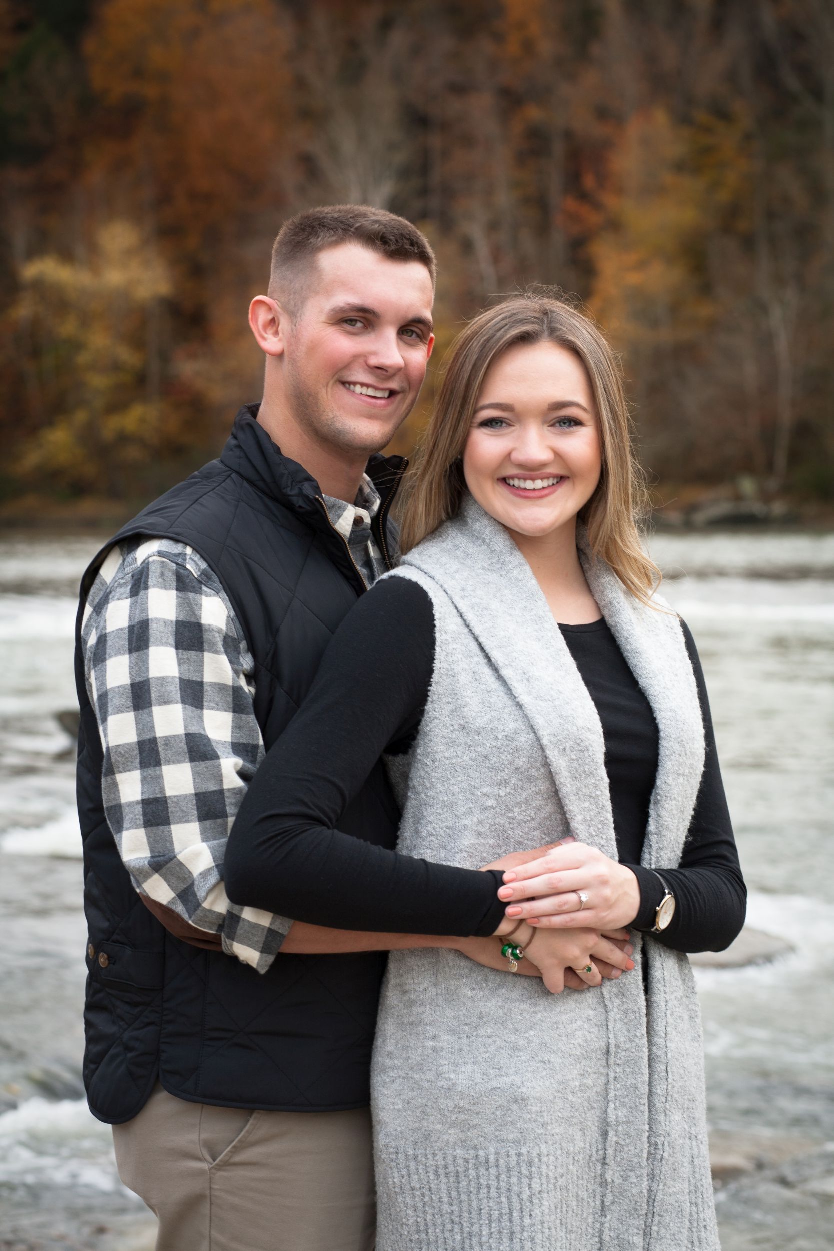 Fiancee and Fiance portrait at Cumberland Falls, Kentucky engagement by Fade To Blaq Photography