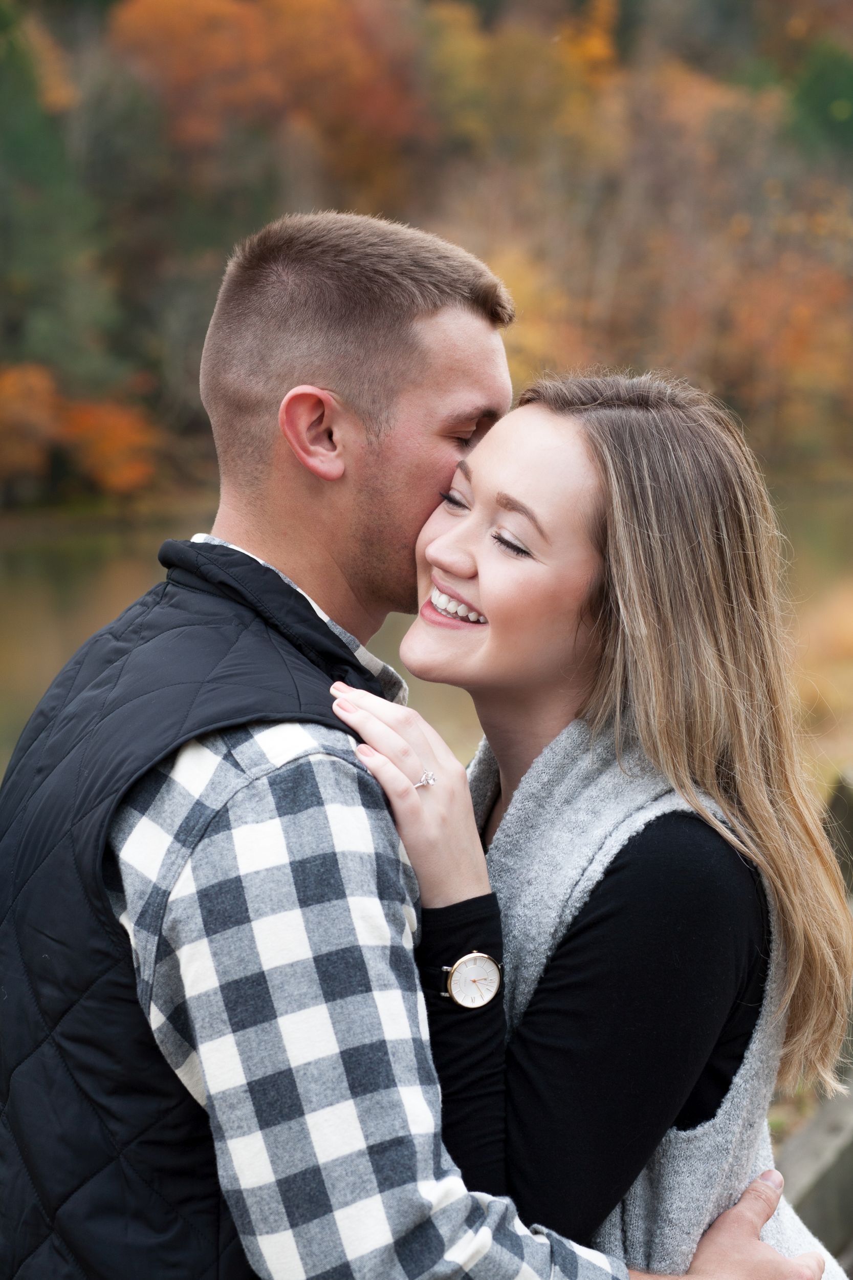 Fiancee and Fiance portrait at Cumberland Falls, Kentucky engagement by Fade To Blaq Photography
